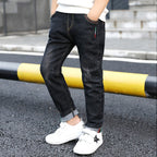 Boy's denim trousers by Ancient Energy, stylish big children's jeans for spring and autumn, featuring a modern design.