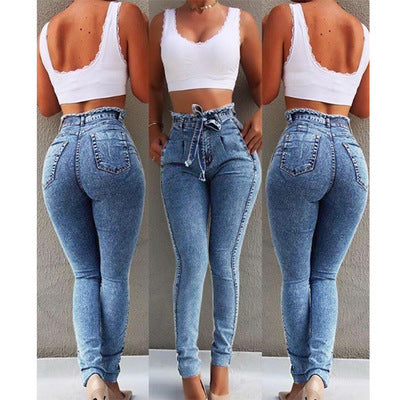 Ancient Energy fringed jeans with distressed details and frayed hems, showcasing casual fashion style.