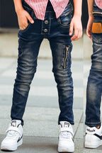 Boy wearing ancient energy stretch denim pants, casual kids' jeans with a comfortable fit and classic blue wash.