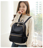 Waterproof black Oxford backpack for women by Ancient Energy, featuring multiple compartments and comfortable straps for school use.