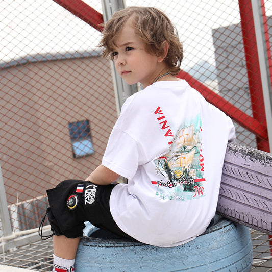 Children's printed T-shirt by Ancient Energy featuring colorful fun design, soft fabric, and comfortable fit for kids.