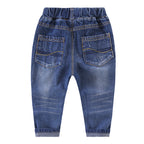 Ripped children's jeans by Ancient Energy showing distressed denim with ripped details and a casual fit.