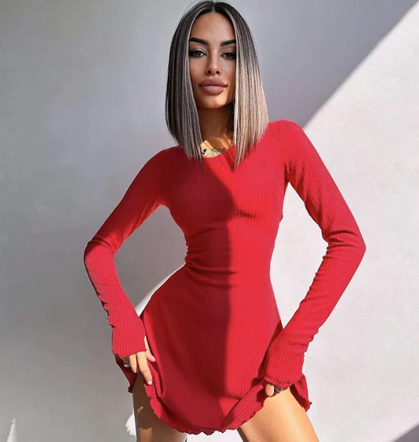 Woman wearing a red ribbed long sleeve pullover dress by Mandotos International