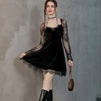 Woman wearing a Mandotos International chic black lace hip-hop velvet dress and black boots.