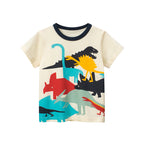 Boy wearing a Boys Short Sleeve T-Shirt by Ancient Energy with a colorful dinosaur cartoon design on the front.