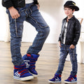 Young boy wearing Ancient Energy jeans, showcasing casual denim pants with a relaxed fit and classic style.