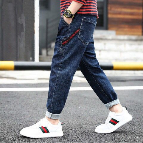 Boys' denim trousers from Ancient Energy, showcasing classic blue jeans with pockets and a relaxed fit for children's casual wear.