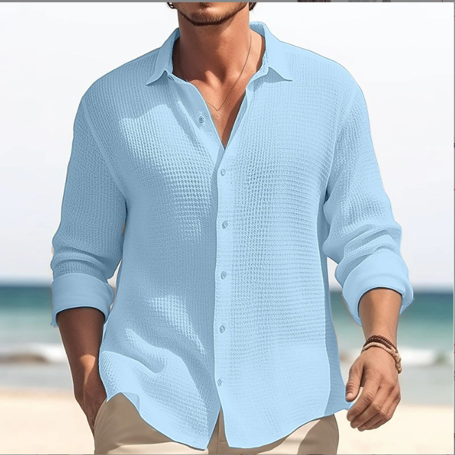Man wearing a light blue casual lapel shirt from Mandotos International