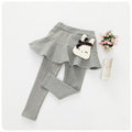 Children's cotton leggings and lace skirt pants set by Ancient Energy, featuring pink and white fabric with playful design details.