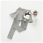 Children's cotton leggings and lace skirt pants set by Ancient Energy, featuring pink and white fabric with playful design details.