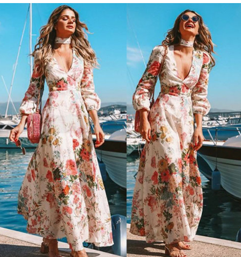 Woman wearing an Elegant Deep V Print Dress by Mandotos International at a marina.