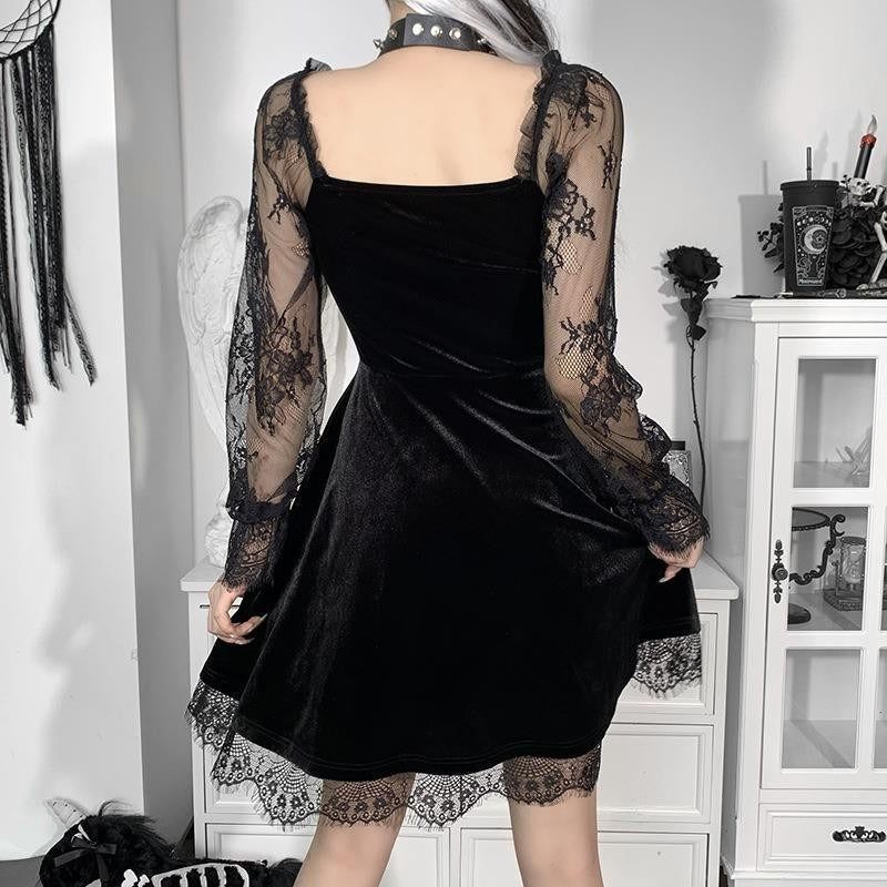 Back view of Mandotos International black velvet hip-hop dress with lace sleeves and hem.
