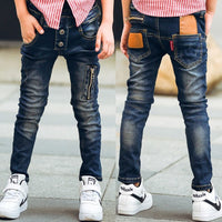 Young boy wearing blue stretch denim pants from Ancient Energy, featuring a comfortable fit and casual style.