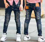 Young boy wearing blue stretch denim pants from Ancient Energy, featuring a comfortable fit and casual style.
