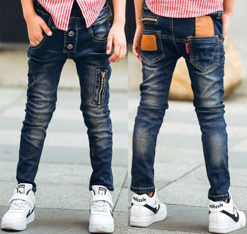 Young boy wearing blue stretch denim pants from Ancient Energy, featuring a comfortable fit and casual style.