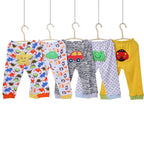 Set of five children's leggings with colorful cartoon prints from Ancient Energy, featuring playful designs for kids.