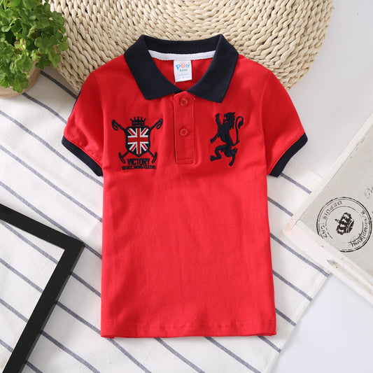 Young boy wearing a blue Ancient Energy polo kids shirt with a collar and short sleeves.