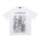 Mandotos International white Urban Graffiti Print Tee with 'SACREDNESS' text and ghostly hand graphic