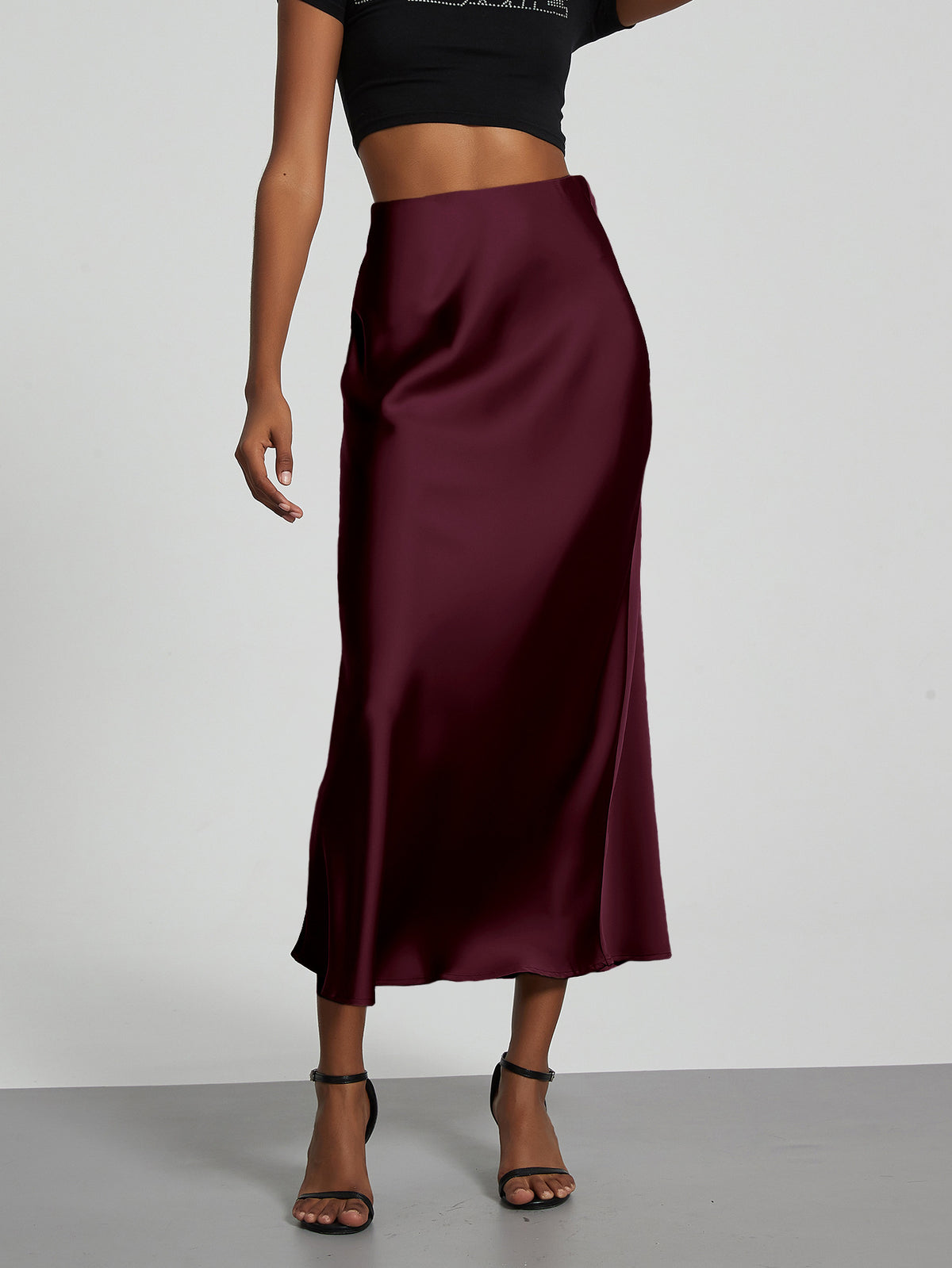 Elegant burgundy satin midi skirt for women, slim fit and flowy style.