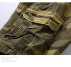 Close-up of men's camouflage outdoor tooling shorts featuring a functional zippered pocket.