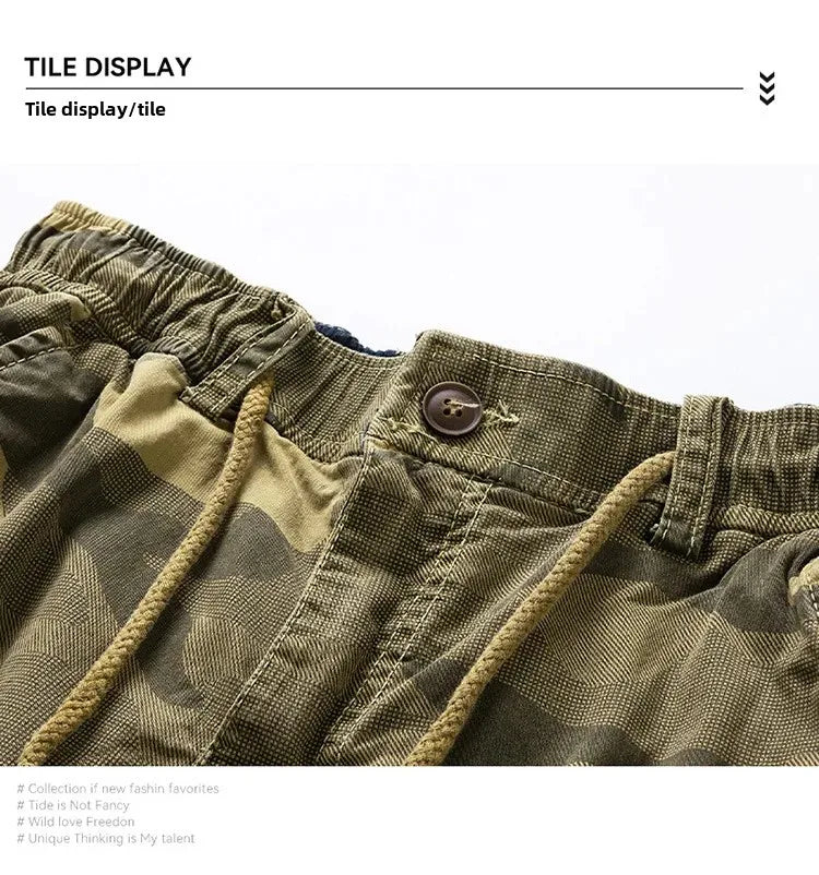 Close-up of men's camouflage outdoor cargo shorts with drawstring waist and button closure.