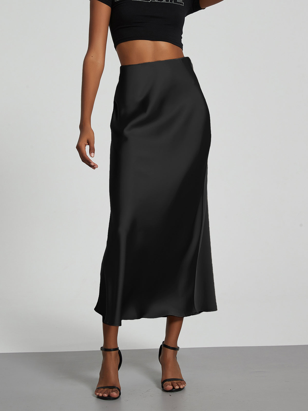 Elegant black satin midi skirt for women, slimming and flowy European style.