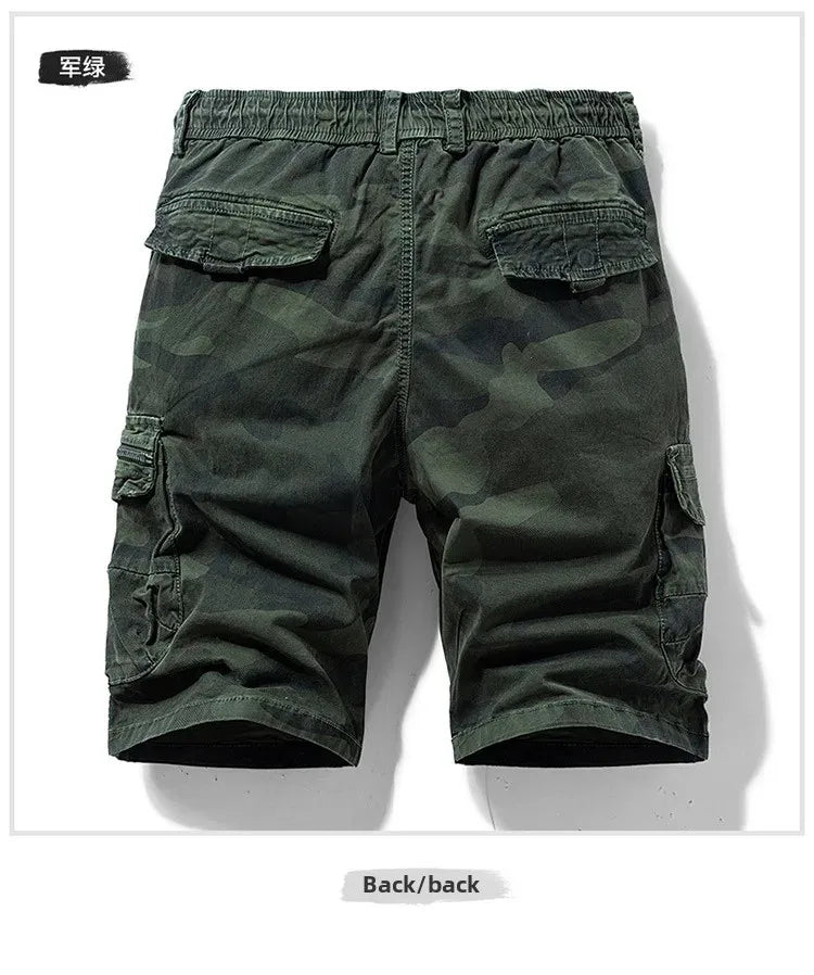 Back view of men's green camouflage outdoor cargo shorts with multiple pockets.