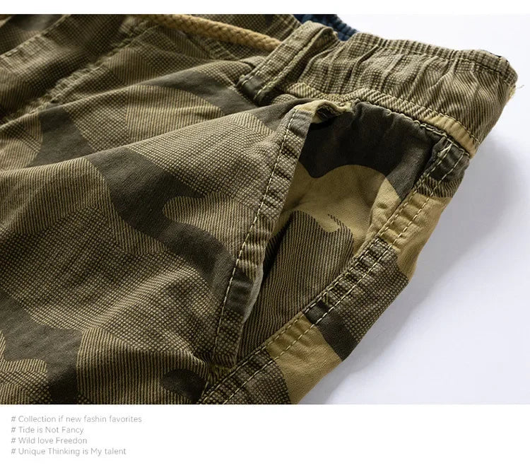 Close-up of men's camouflage pattern outdoor cargo shorts in olive green.