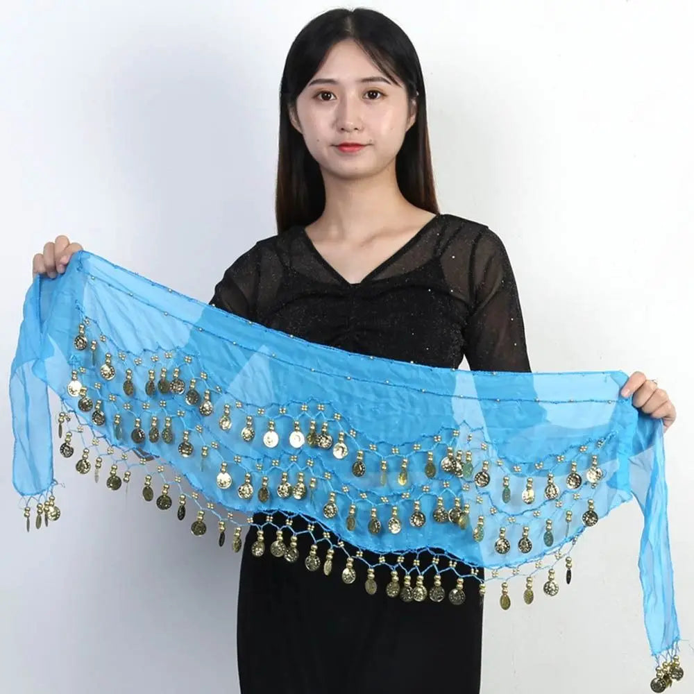 Woman holding a blue belly dance hip scarf with gold coin tassels by Mandotos International