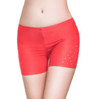 Red tight-fitting belly dance safety shorts with diamond embellishments by Mandotos International