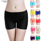 Black belly dance safety shorts with diamond embellishments and various color options.
