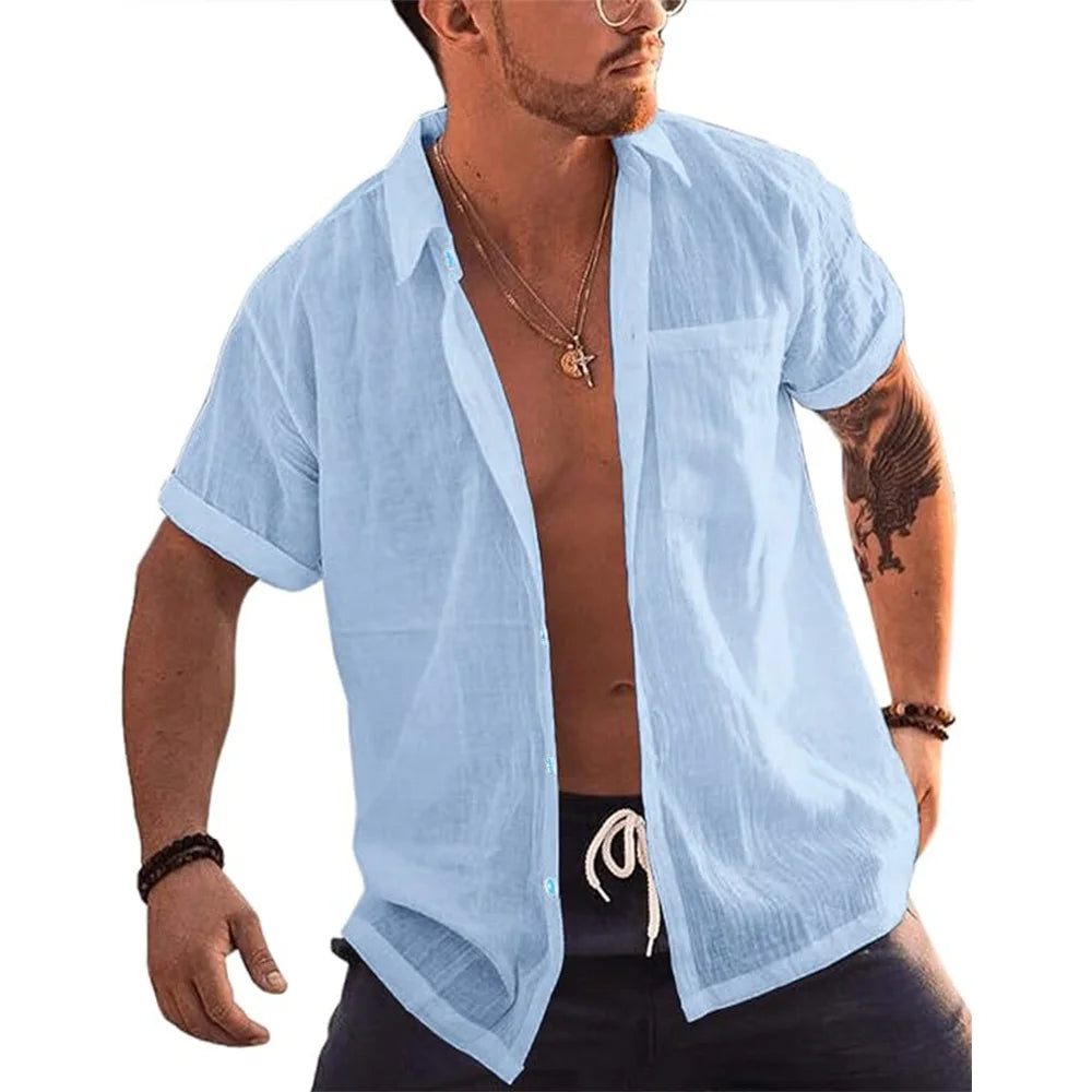 Man wearing a Mandotos International light blue short sleeve linen cotton button up beach shirt.