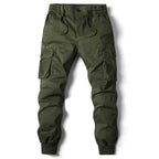 Men's olive green cotton cargo jogger pants with tactical military pockets.