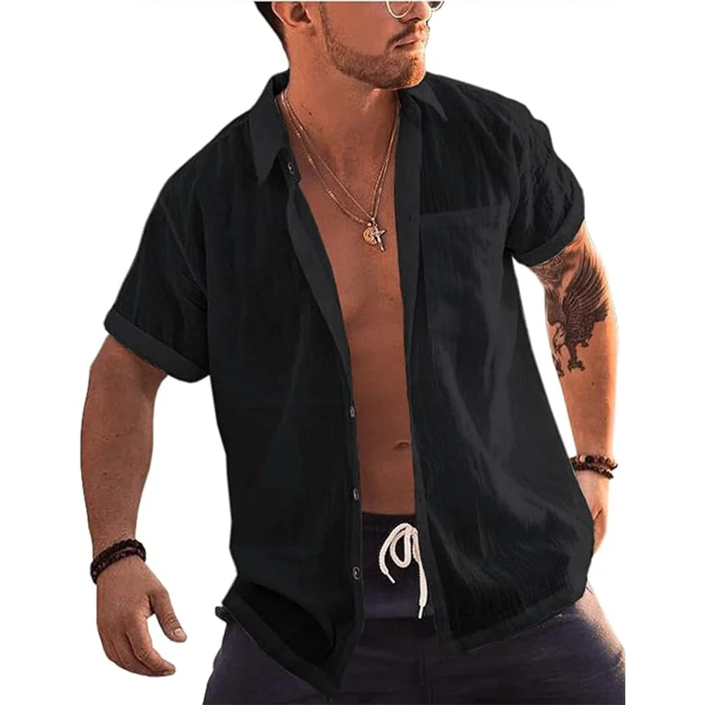 Man wearing a black Mandotos International linen cotton short sleeve button up beach shirt.