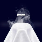 Close-up of breathable white textured fabric with steam rising against a dark background.