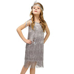 Girl in silver flapper dress with fringe and sequins for carnival or Latin dance