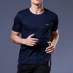 Man wearing a navy blue Mandotos International quick-dry compression running t-shirt