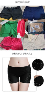 Mandotos International belly dance safety shorts in black, blue, green, pink, and beige with diamonds.