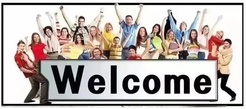 A diverse group of happy people celebrating with arms raised behind a large Welcome sign.