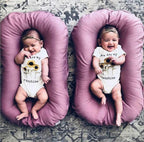 Ancient Energy baby nest bed crib with soft cotton cushion, portable infant cradle for newborns and travel convenience.