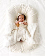 Ancient Energy baby nest bed crib for newborns, portable cotton infant cradle with cushion for travel and comfort.