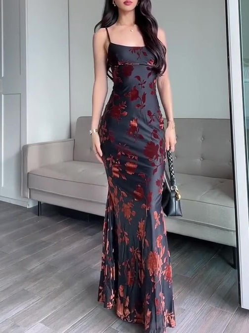 Ancient Energy black flocked strappy maxi dress featuring a fitted bodice and flowing skirt, ideal for elegant occasions.