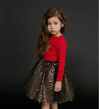 Girls' dress by Ancient Energy, featuring a colorful floral pattern and lightweight fabric perfect for warm weather.