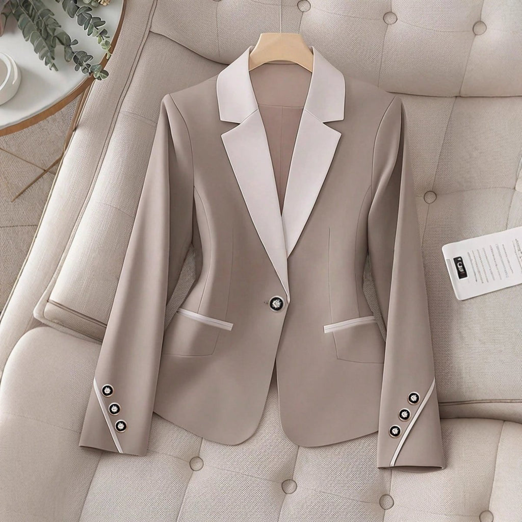 Elegant formal blazer by Ancient Energy with contrasting color buttons, tailored for a sophisticated professional look.