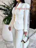 Solid color single-breasted blazer and high-waisted pants set by Ancient Energy, shown on a model, in a stylish, modern fit.