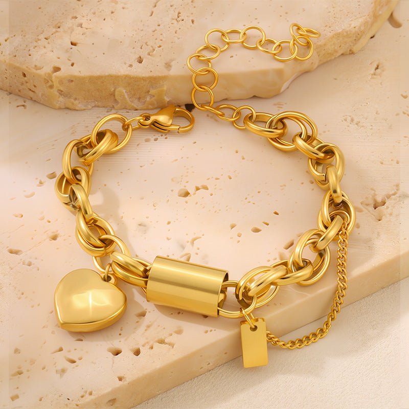 Ancient Energy titanium bracelet featuring a heart-shaped pendant, sleek and versatile jewelry design.