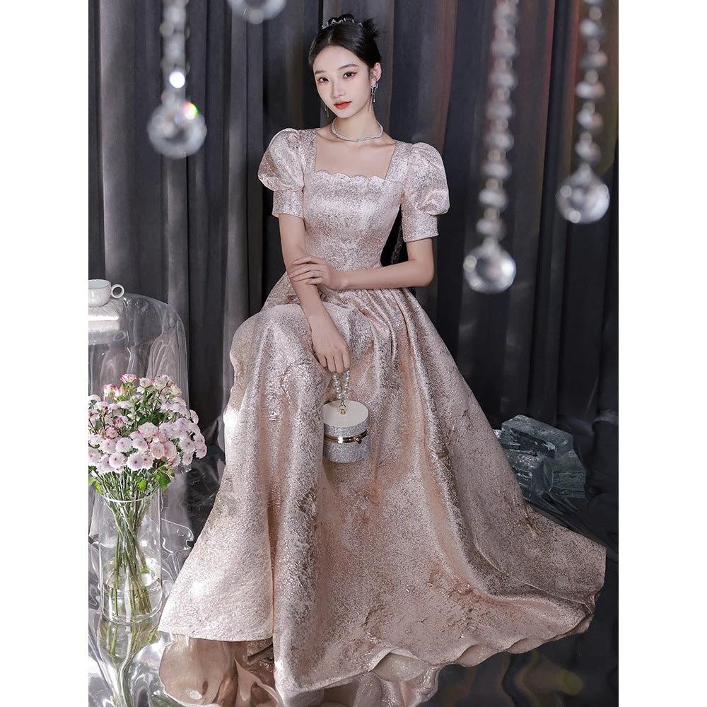 Elegant women’s champagne evening dress by Ancient Energy, featuring a flowing design perfect for formal occasions.