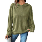 Woman wearing a Mandotos International olive green casual textured knit hoodie and blue jeans
