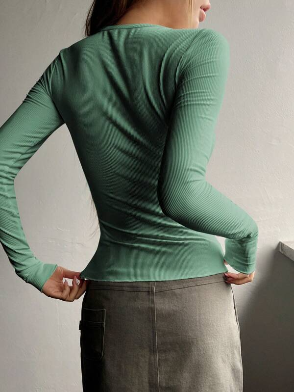Mandotos International chic sage green ribbed long sleeve half-button women's tee.