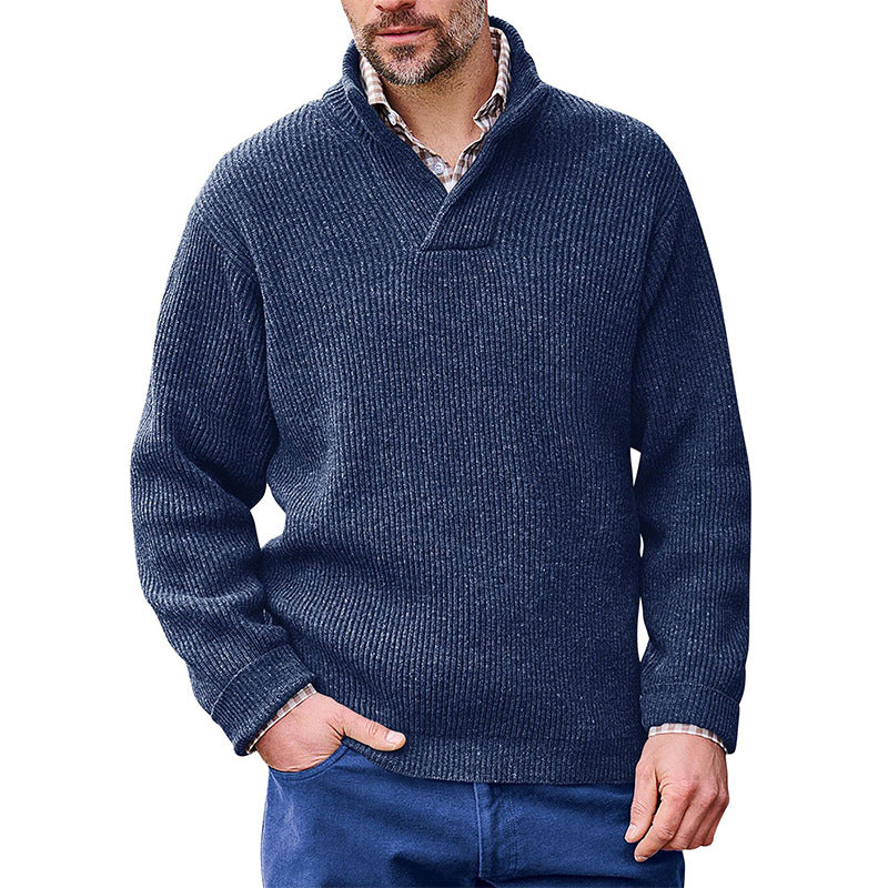 Man wearing a Mandotos International navy blue high neck classic ribbed sweater.